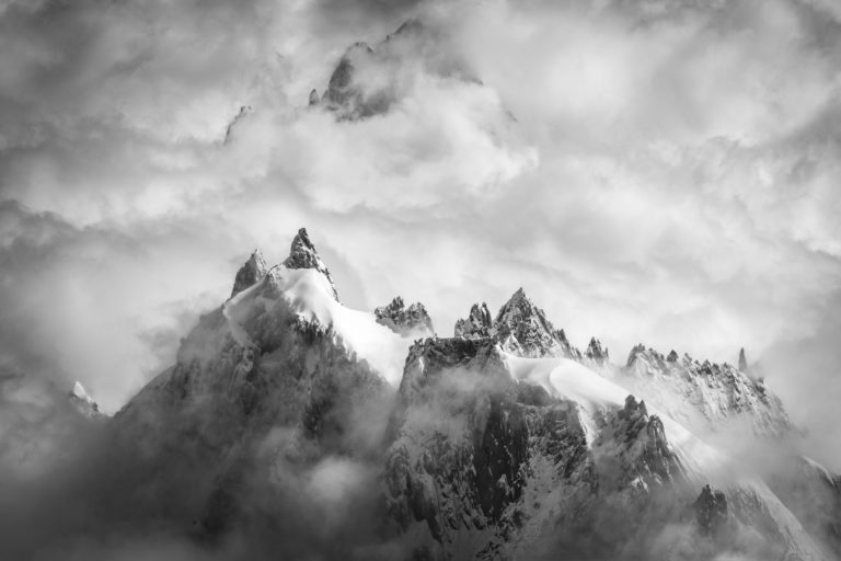 Aiguilles of chamonix - Aiguilles of chamonix panorama in a sea of clouds and mist after a storm in the mountains of Switzerland