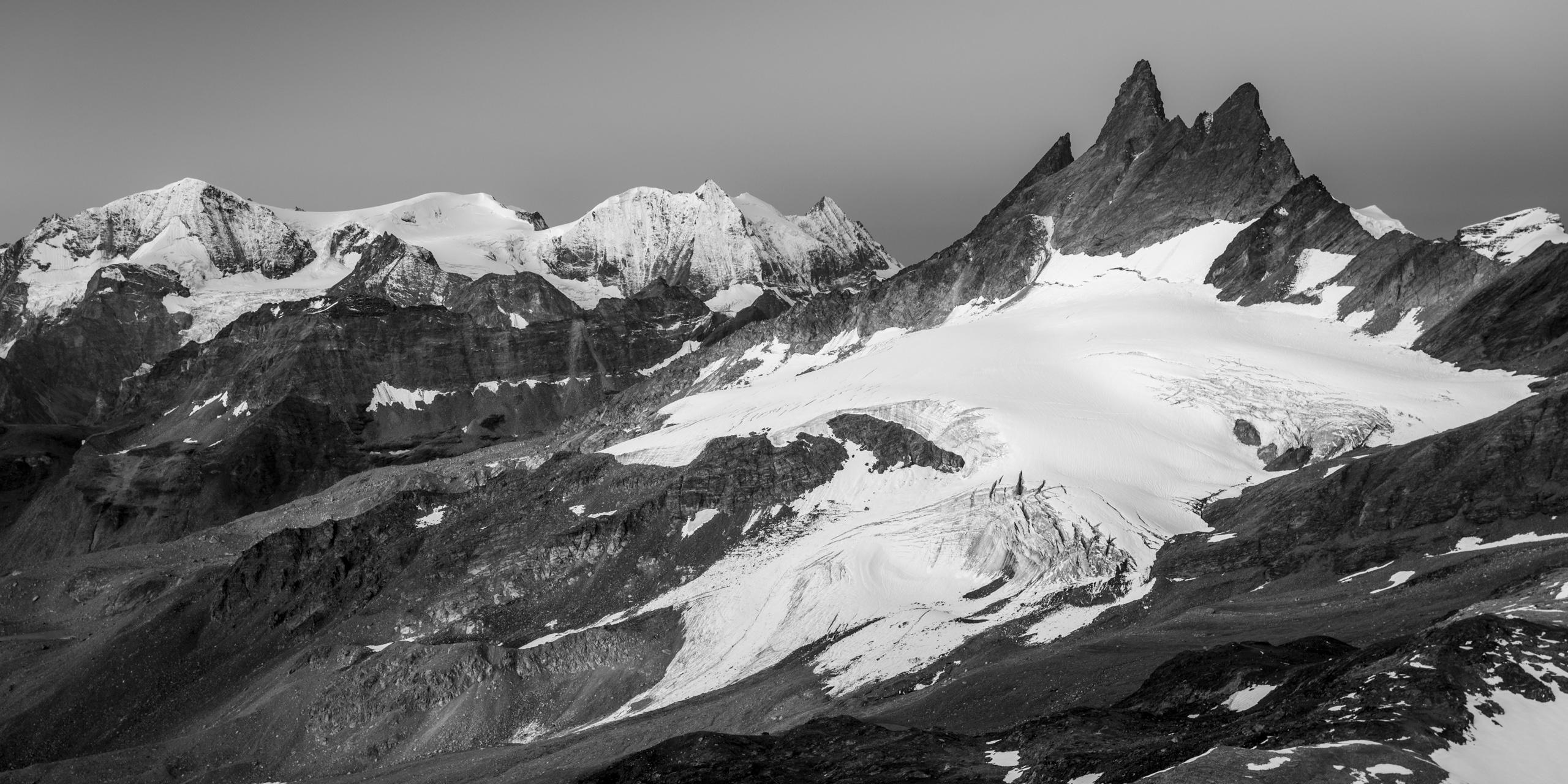 Panoramic view of the snow-capped mountain peaks of Arolla Aiguilles Rouges - Mont Blanc de Cheillon and La Ruinette