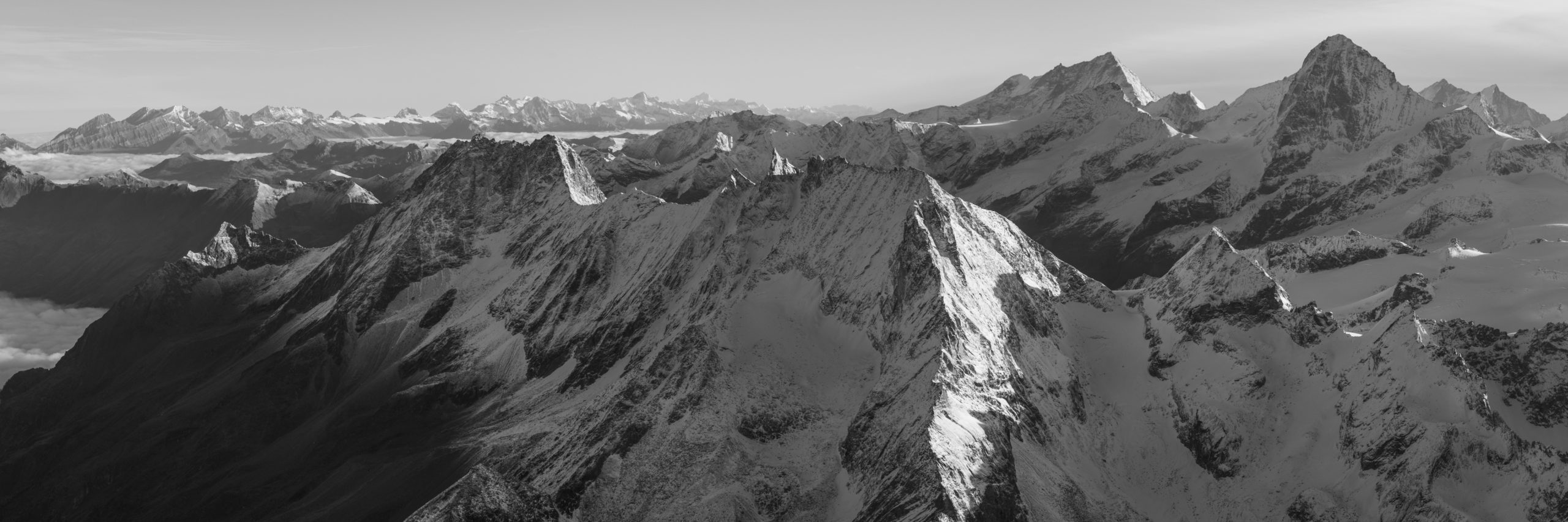 Black and white panoramic view of the Bernese and Valaisan Swiss alps mountain range