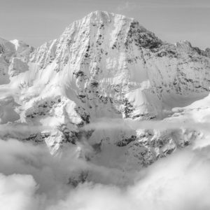 Grindelwald - Breithorn - black and white mountain picture of the massif peaks in a sea of clouds