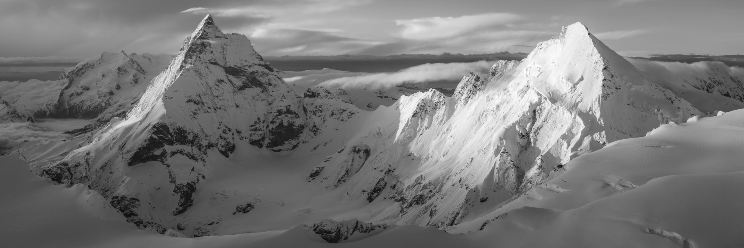 Black and white panoramic photo of the Matterhorn and The Dent d'Hérens