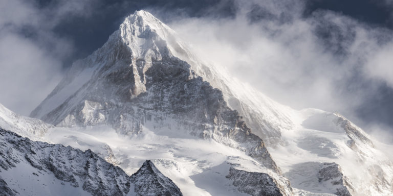 Dent Blanche - Black and white photography of thr Top of the rocky Alpines mountains in a sea of clouds