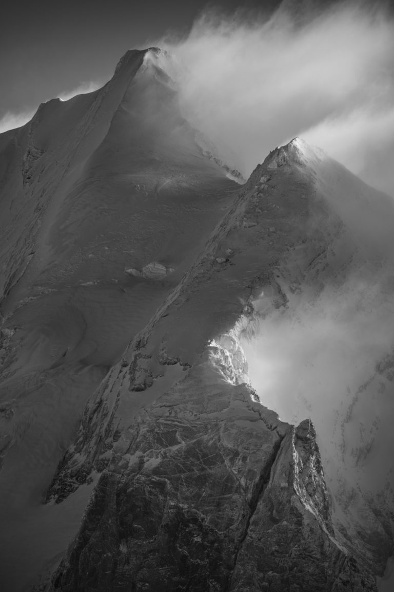 Doldenhorn - black and white mountain summit and peak in the Swiss bernese alps after a storm