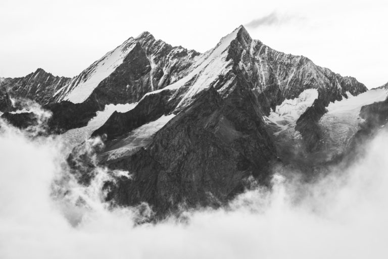 Valley Zermatt - image mountain Alps- Dom - Taschhorn in a sea of clouds