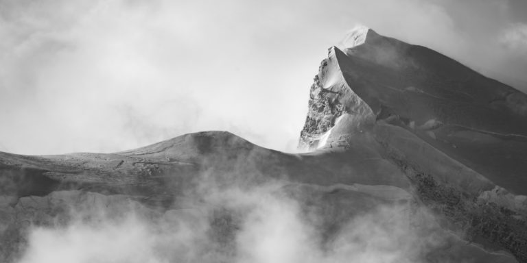Grand Combin -black and white hd alpines mountain photo and peaks with sea of foggy cloud after a snowstorm