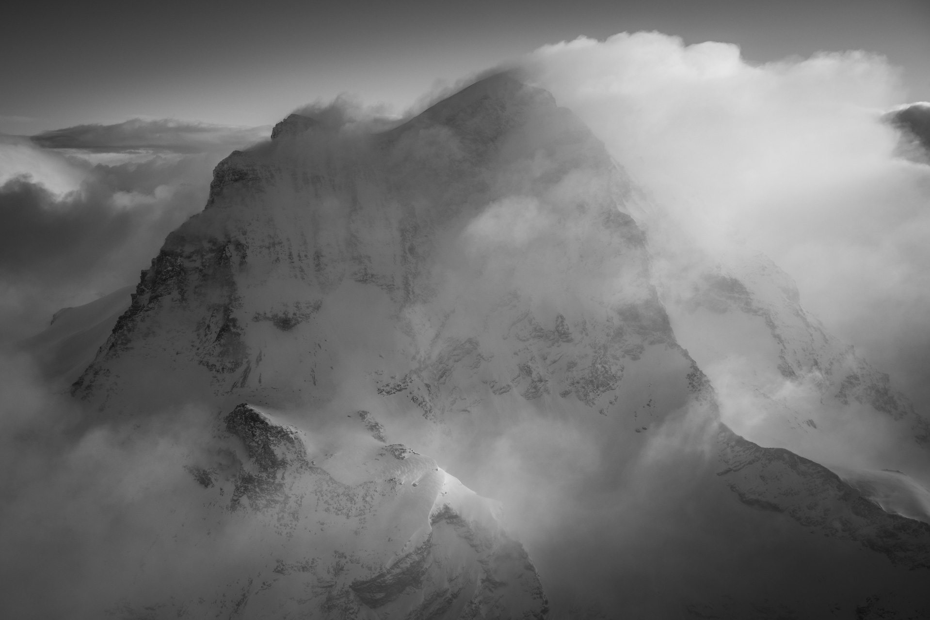 black and white mountain photo of the snowy summits of the Grand Combin mountains of the Swiss Alps from Verbier