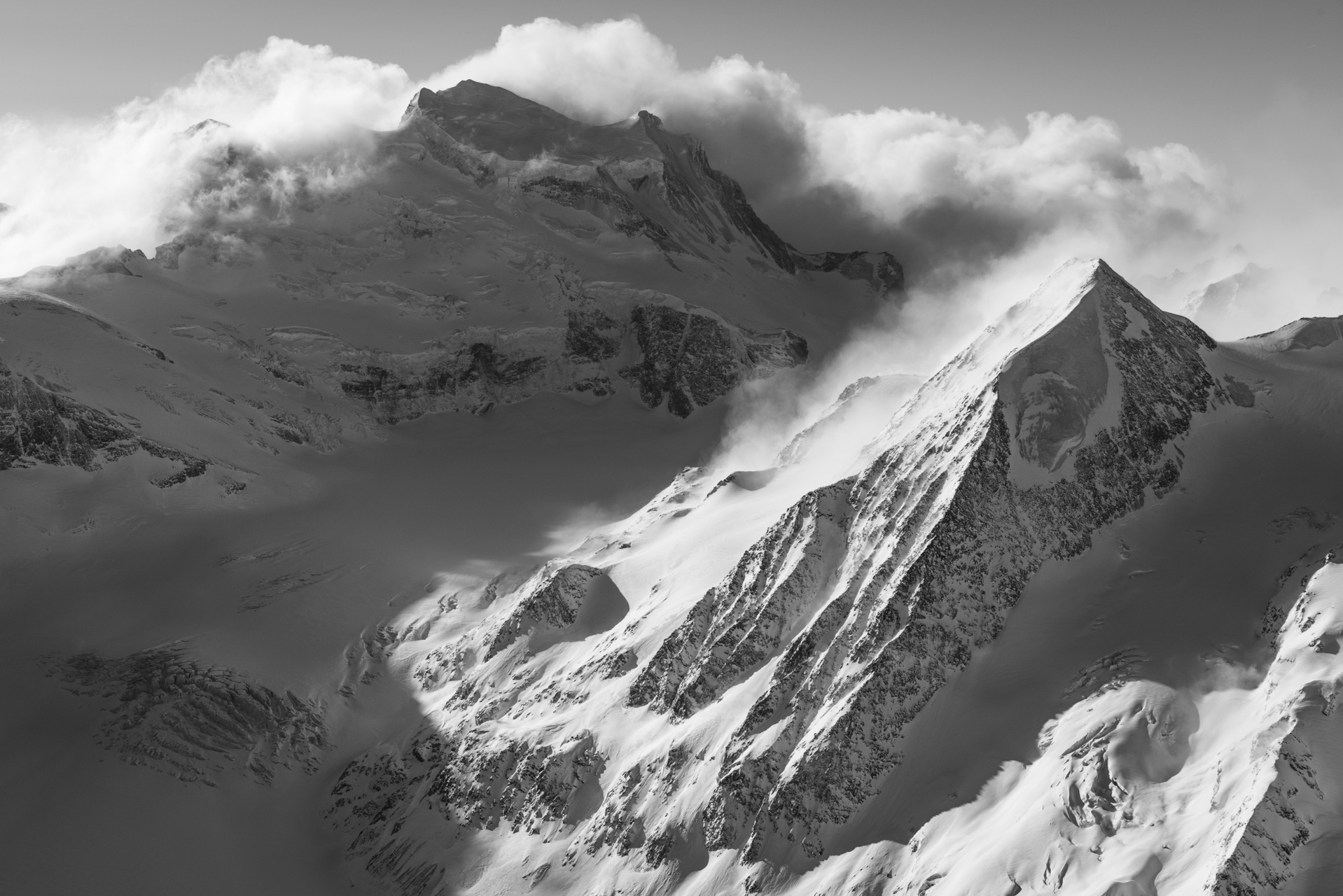 Grand Combin and Combin de Corbassière - black and white image of high verbier mountains 