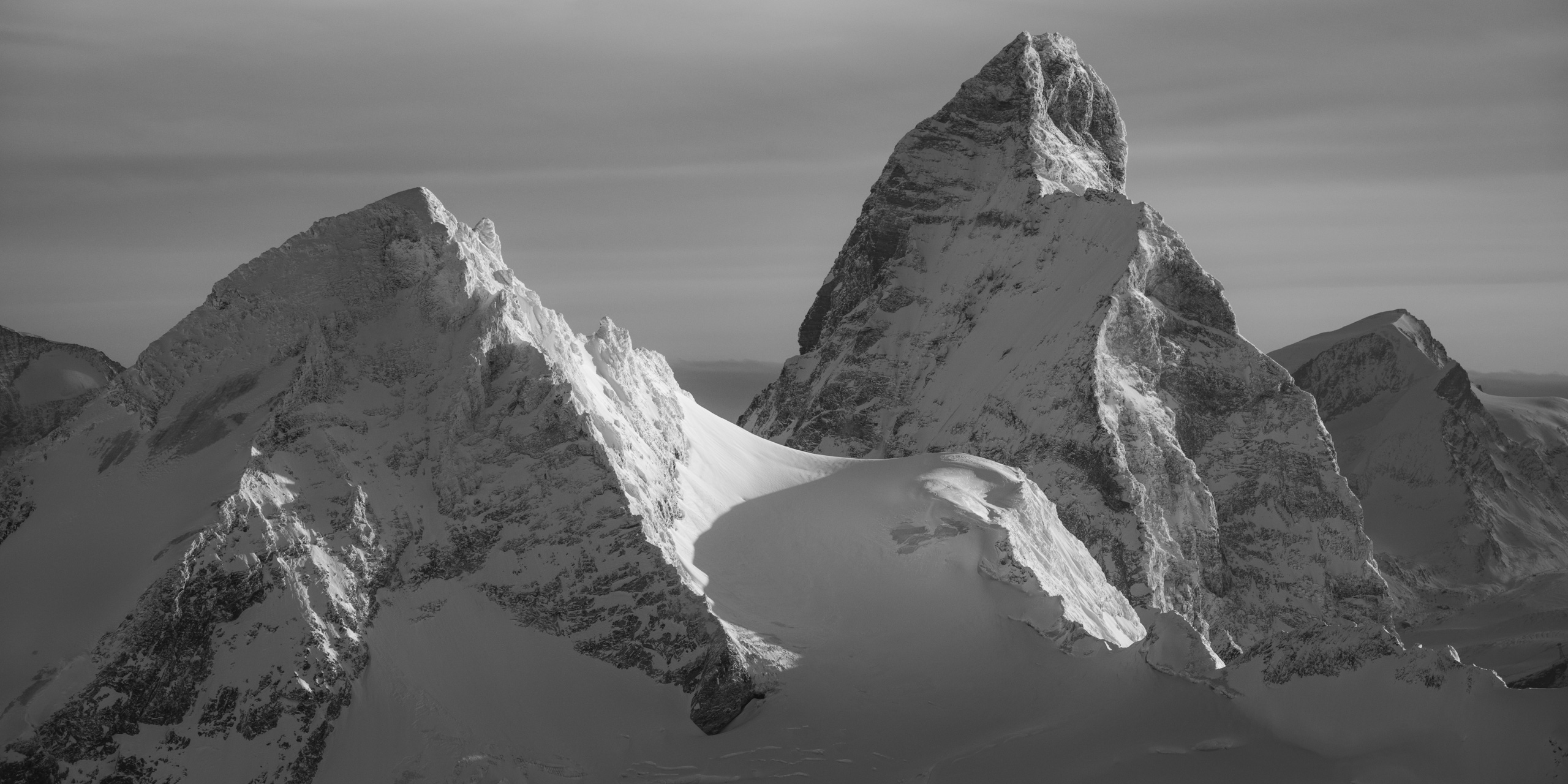 black and white Panoramic view of a Swiss mountain landscape in Hérens - Matterhorn - Strahlhorn in the sunshine