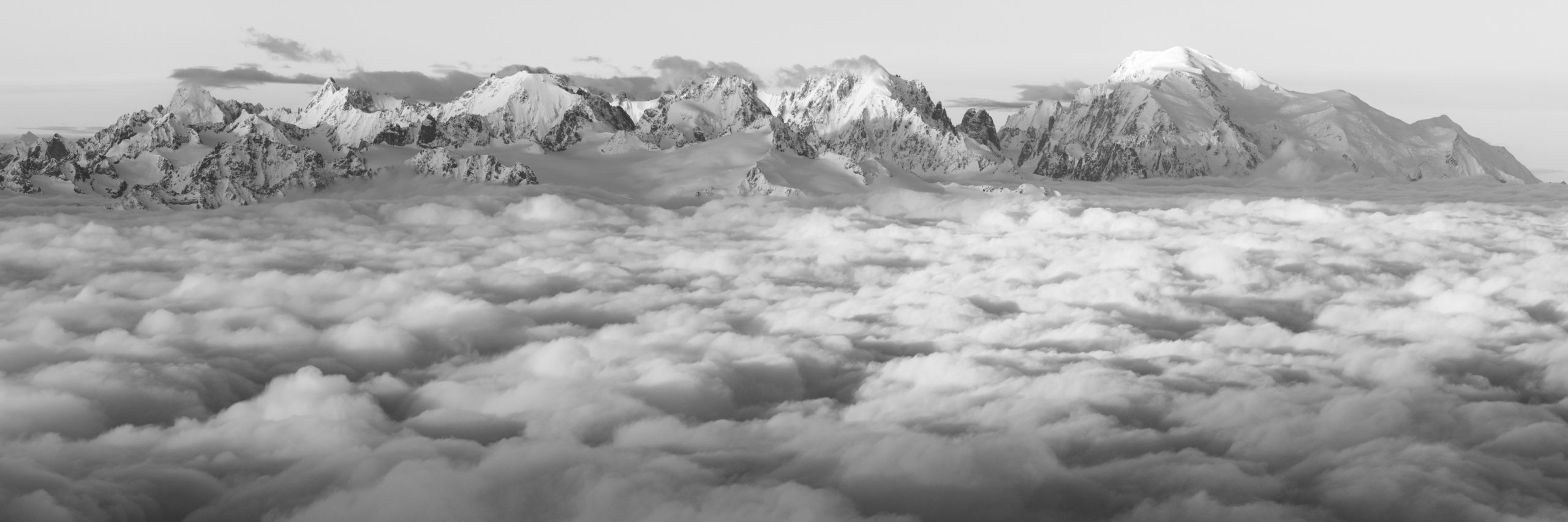 black and white panorama mountain view of the  mont blanc above a sea of clouds - black and white mountain photo print and professional framing