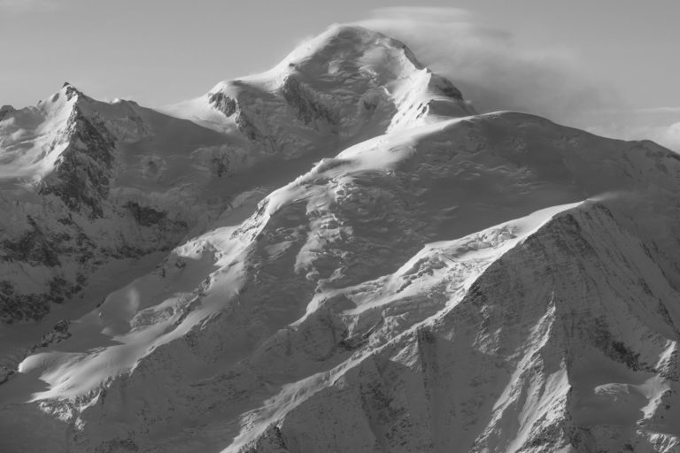 Mont Blanc peak - black and white photo of the mont blanc - Normal route and Grands Mullets hut after a storm in the mountains