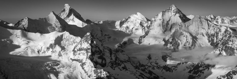 Val d&#039;Anniviers - Black and White panoramic photo of the Swiss rocky mountains in the Alps