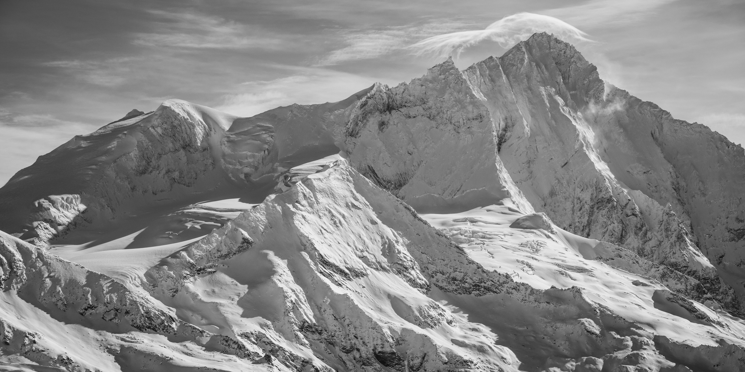 Black and white panorama of the rocky mountain peaks of Weisshorn from Grimentz in the Valais Alps from Crans Montana