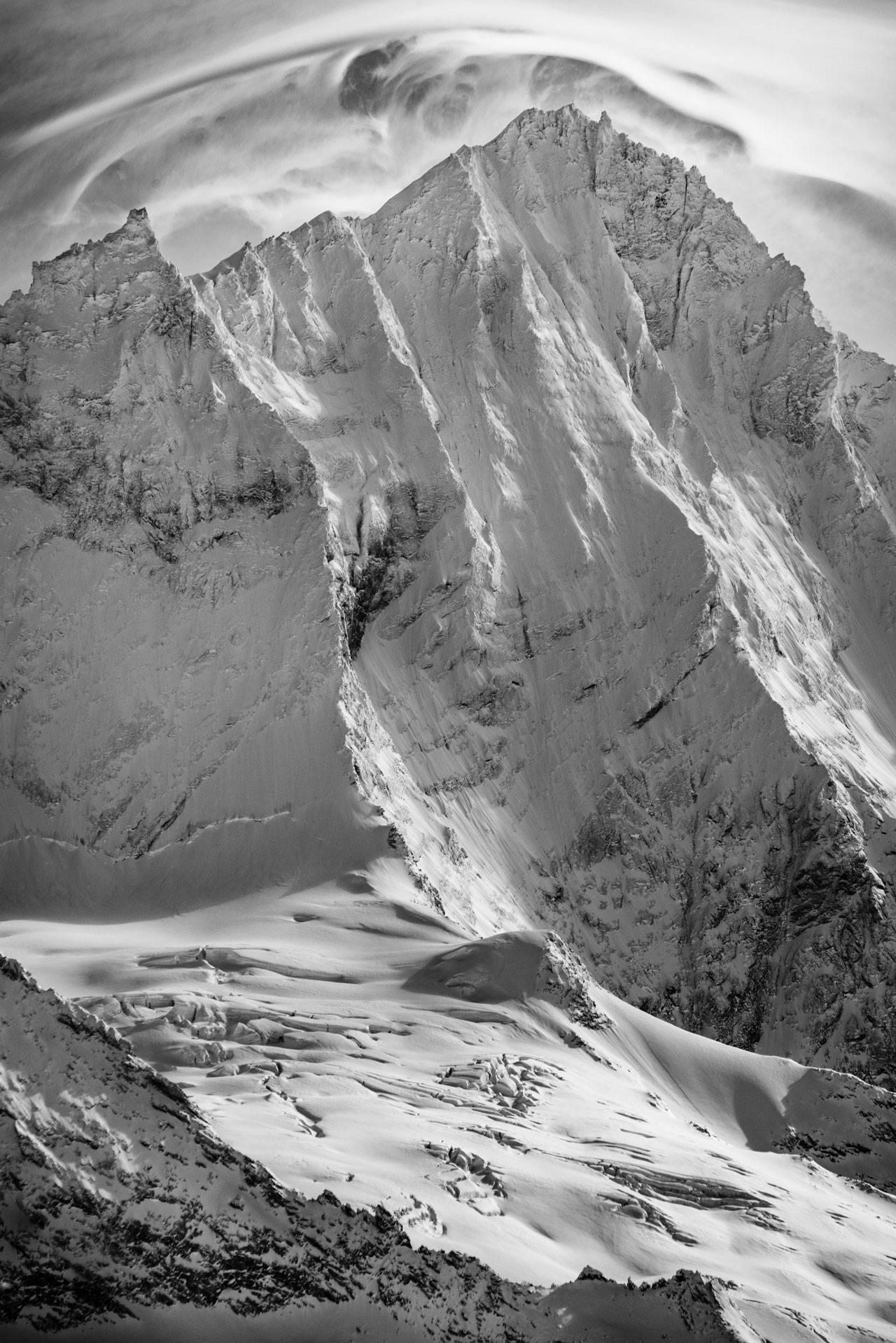 Black and white image of the summit rocky mountain of the Weisshorn from Grimentz in the Valais Alps