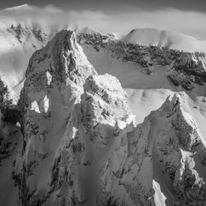 Portrait of the Tschingelhörner of Flims - View on the characteristic summits of the Tschingelhörner above Flims after a snowstorm - Black and white picture of the Tschingelhörner of Flims
