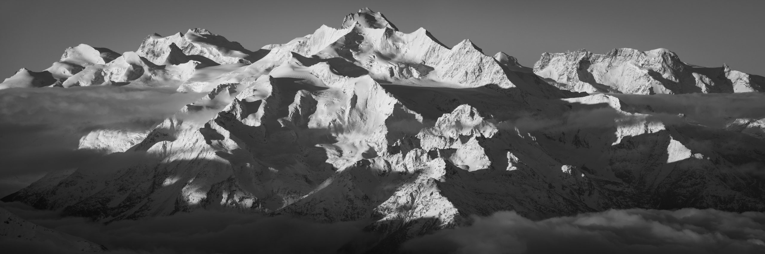panoramic image of the mountains of Saas Fee - Panoramic view of the Mischabels - Panorama of the Monte Rosa from Breithorn above Zermatt