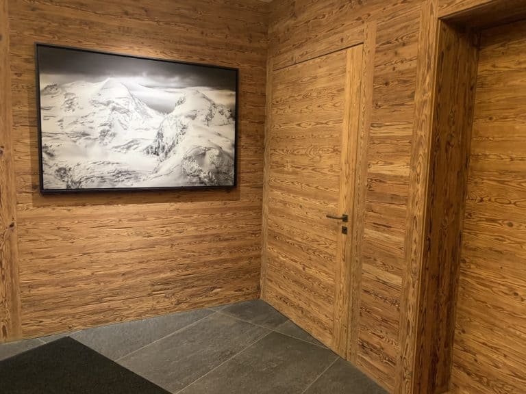 interior decoration mountain chalet cosy wall in larch from the Valais - frame large format mountain photo