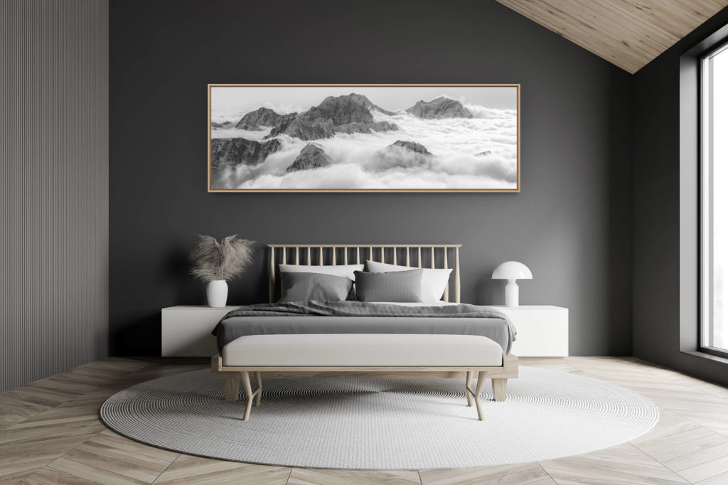 modern adult bedroom decoration in a small swiss chalet - large mountain picture - Panoramic picture of the Bernina Massif with clouds