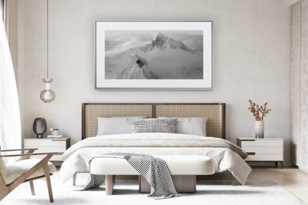 decorating a room in a renovated swiss chalet - panoramic mountain photo - Black and white panoramic photo frame of the Zinalrothorn and the Schalihorn in the Swiss mountains