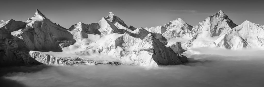 Photographie de la Couronne Impériale de Zinal. Panoramic view of the Val d&#039;Anniviers 4000s. The high summits emerge from the sea of clouds, offering the viewer a celestial vision of Switzerland&#039;s most beautiful mountains.