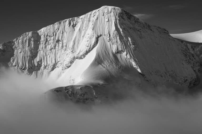 Black and white photograph of the Pigne d&#039; Arolla north face Val d&#039;Hérens Valais Alps morning mist