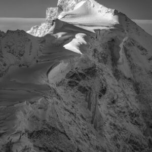 Zinalrothorn north face black and white hanging glaciers crevasses granite summit sunrise