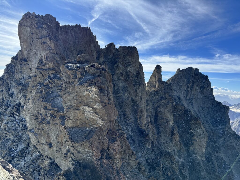 Between light and shade, progress along the ridge linking the Schreckhorn to the Lauteraarhorn.