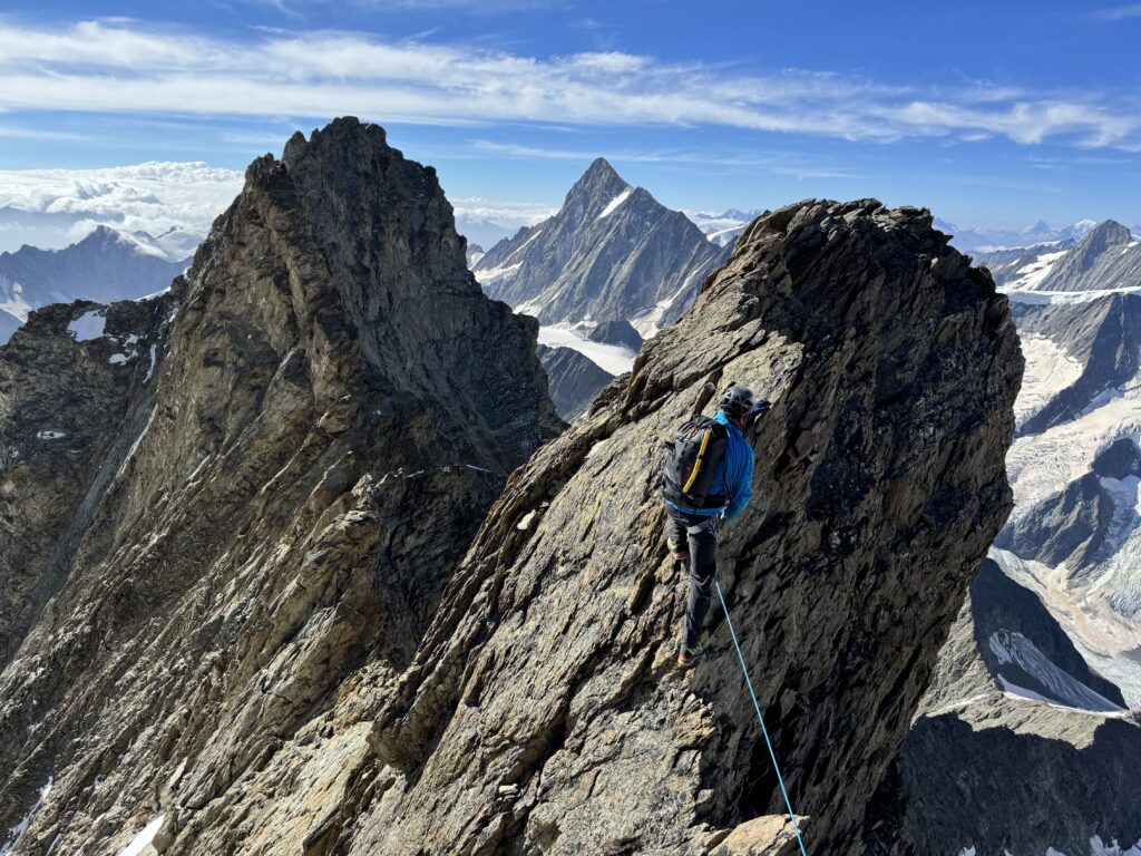 The sun illuminates the ridges of the Schreckhorn, a magical moment in the Swiss Alps.