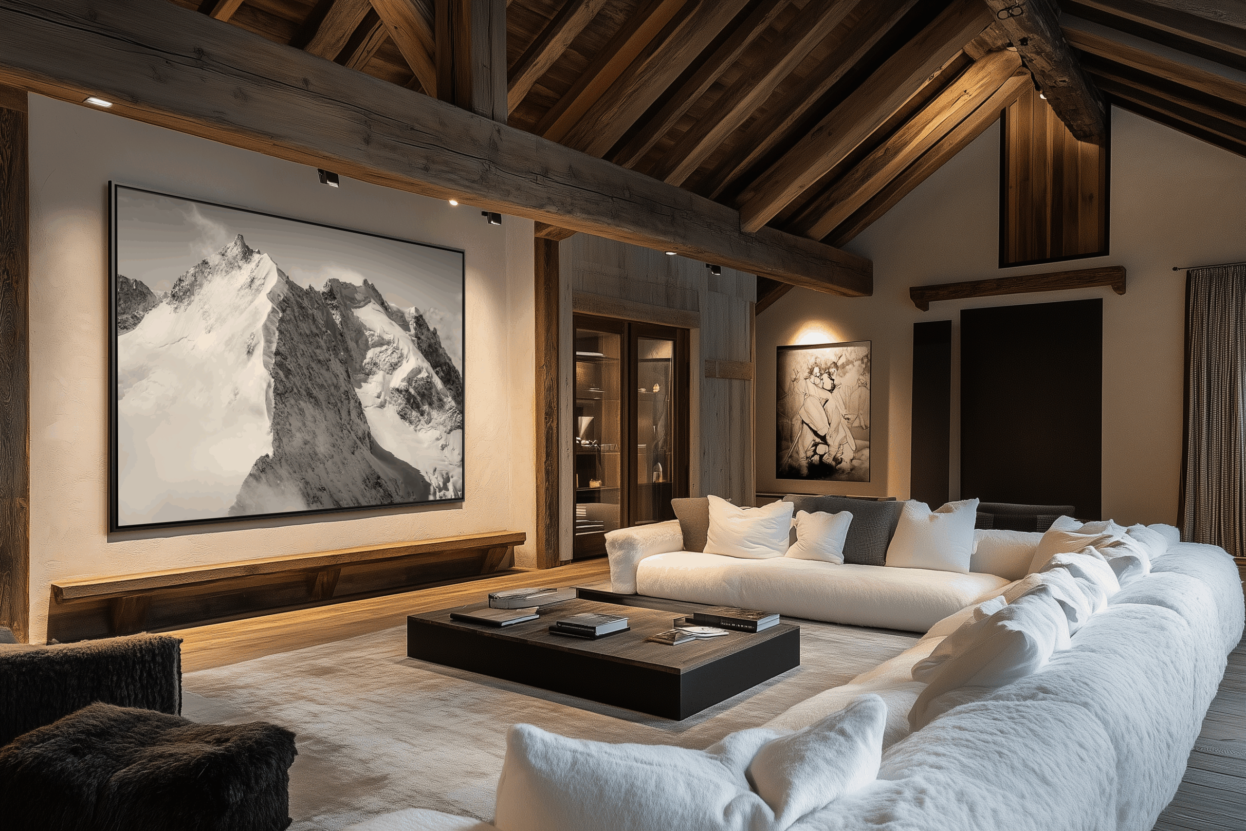 L’élégance sobre d’une photographie de montagne en noir et blanc s’accorde à la chaleur du bois et aux lignes épurées, créant une atmosphère conviviale et authentiquement alpine.