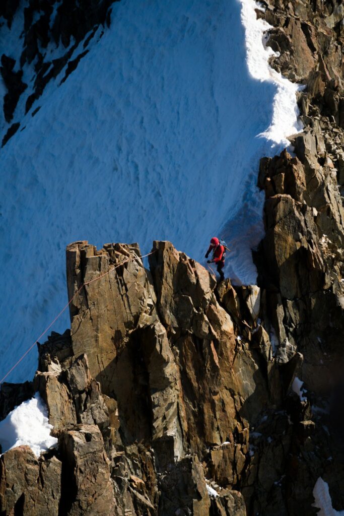 Mountaineer on a ridge, Brouillard red pillar in the Mont Blanc massif