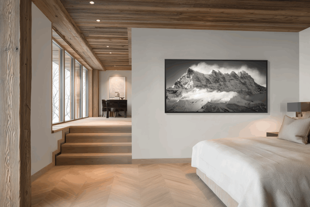 The Dents du Midi, draped in clouds, breathe mystery and emotion into this alpine setting where time seems suspended.